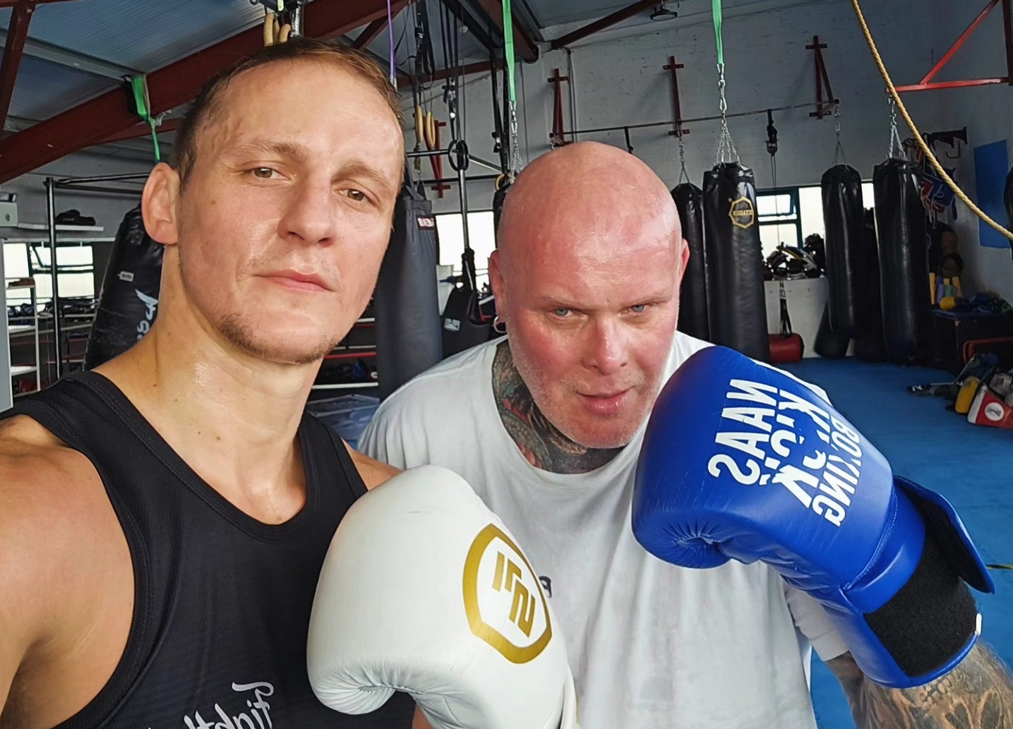 Coaches encouraging students during sparring